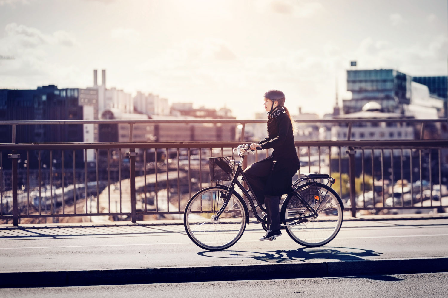 businesswoman-riding-bicycle-in-city