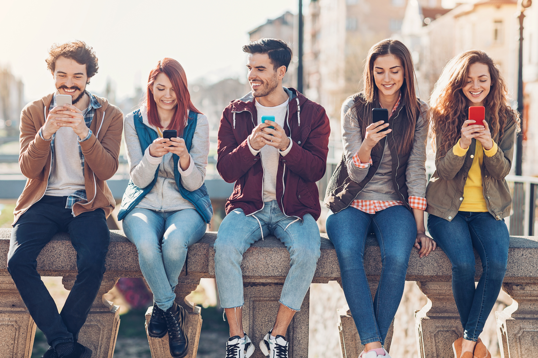 People in a row with phones