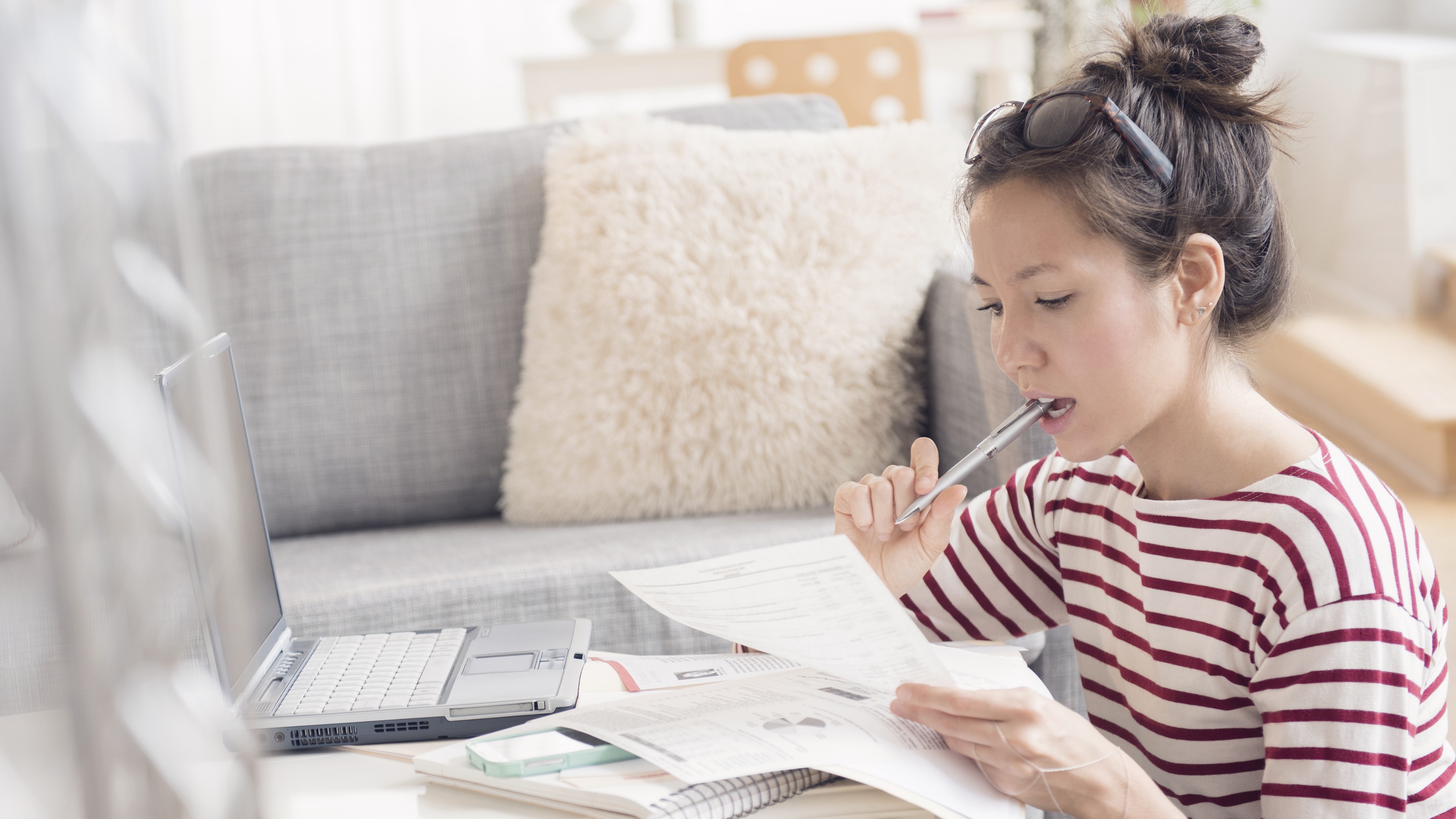 Woman paying bills on laptop
