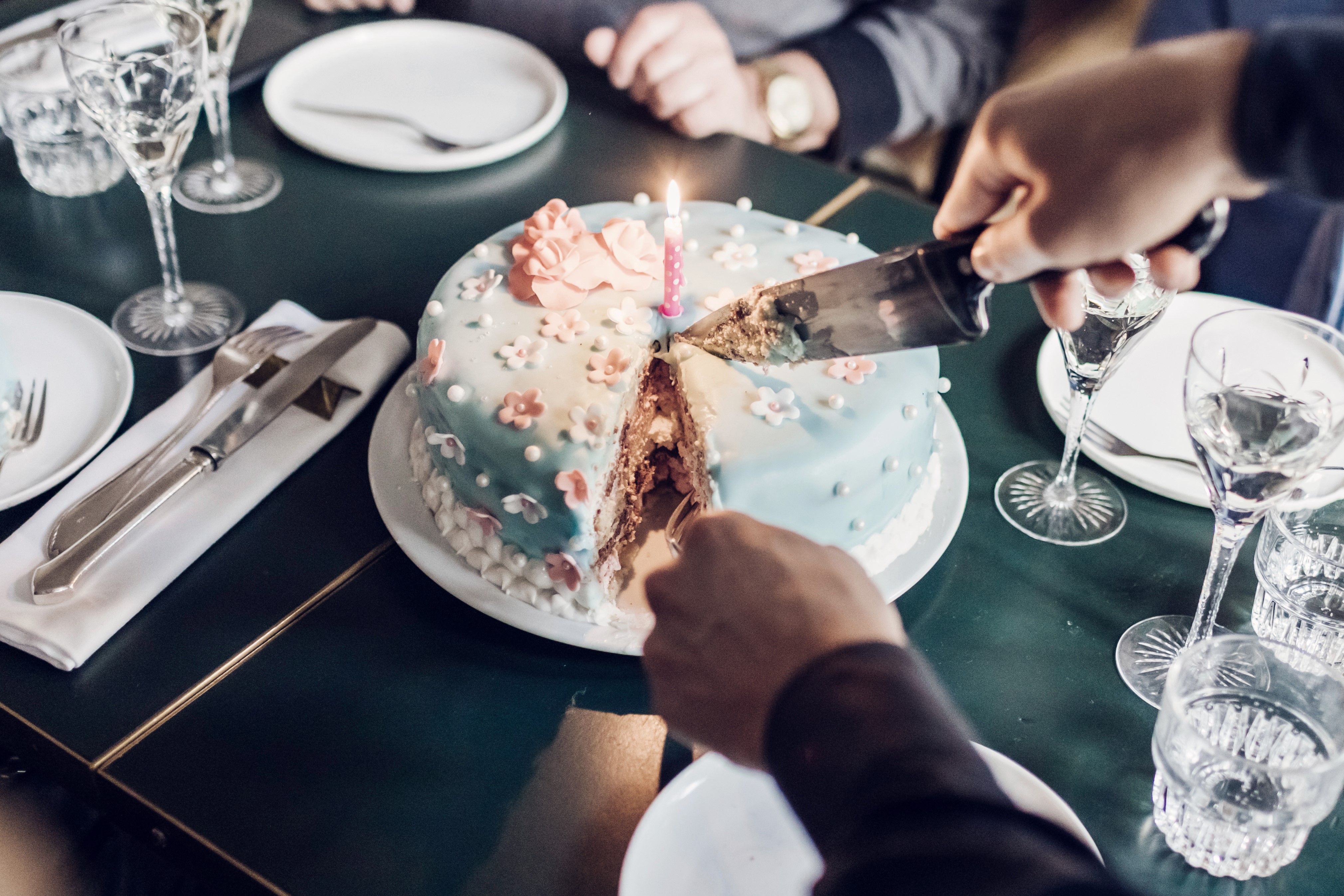 Birthday cake being served in restaurant