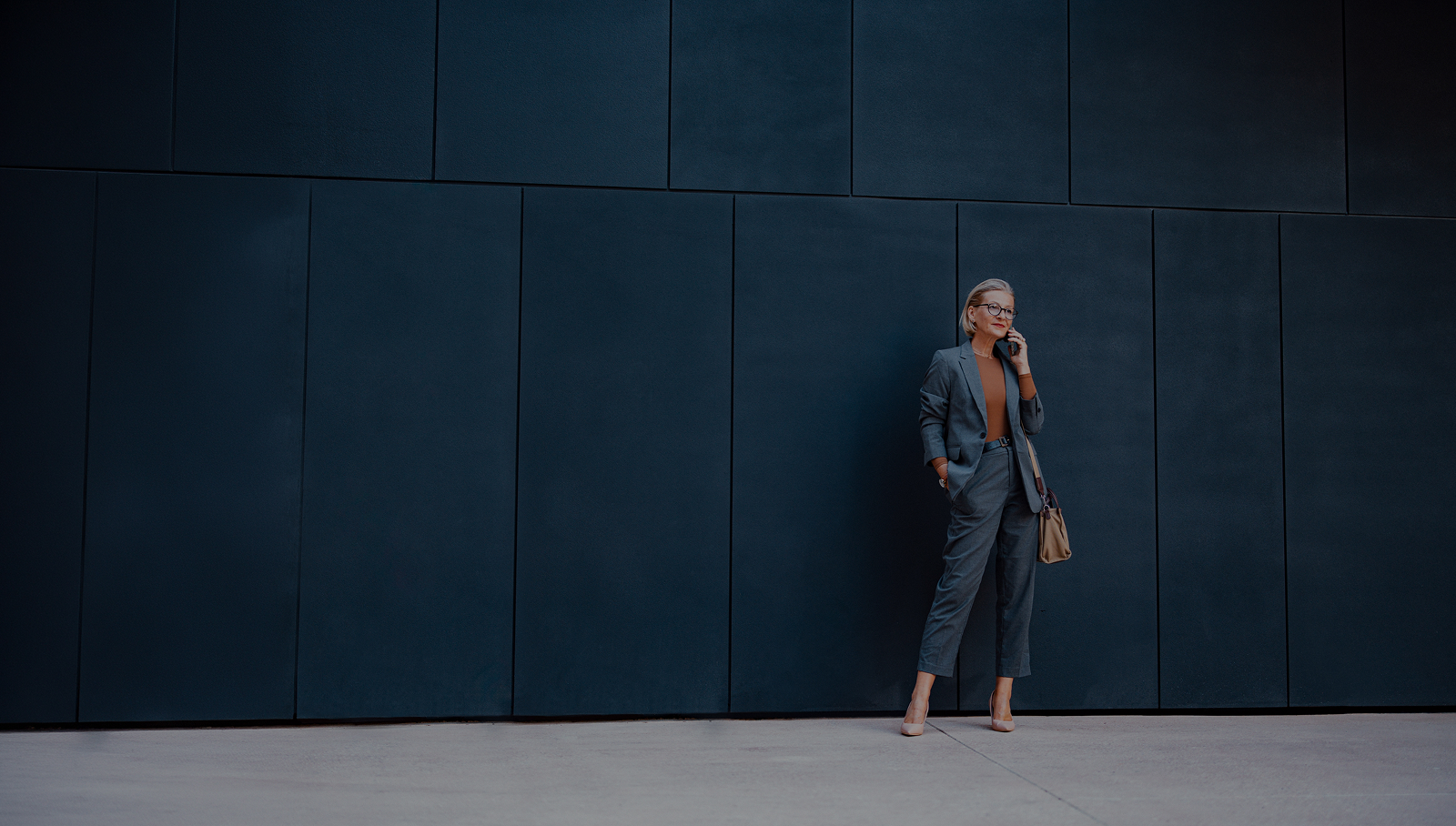 Woman near a wall