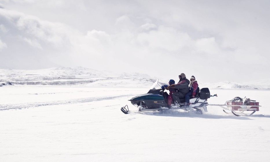 family on snowmobile