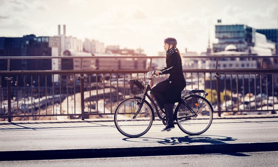 businesswoman-riding-bicycle-in-city