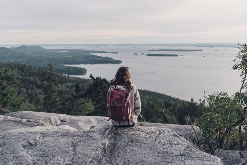 Woman looking at lake in Finland