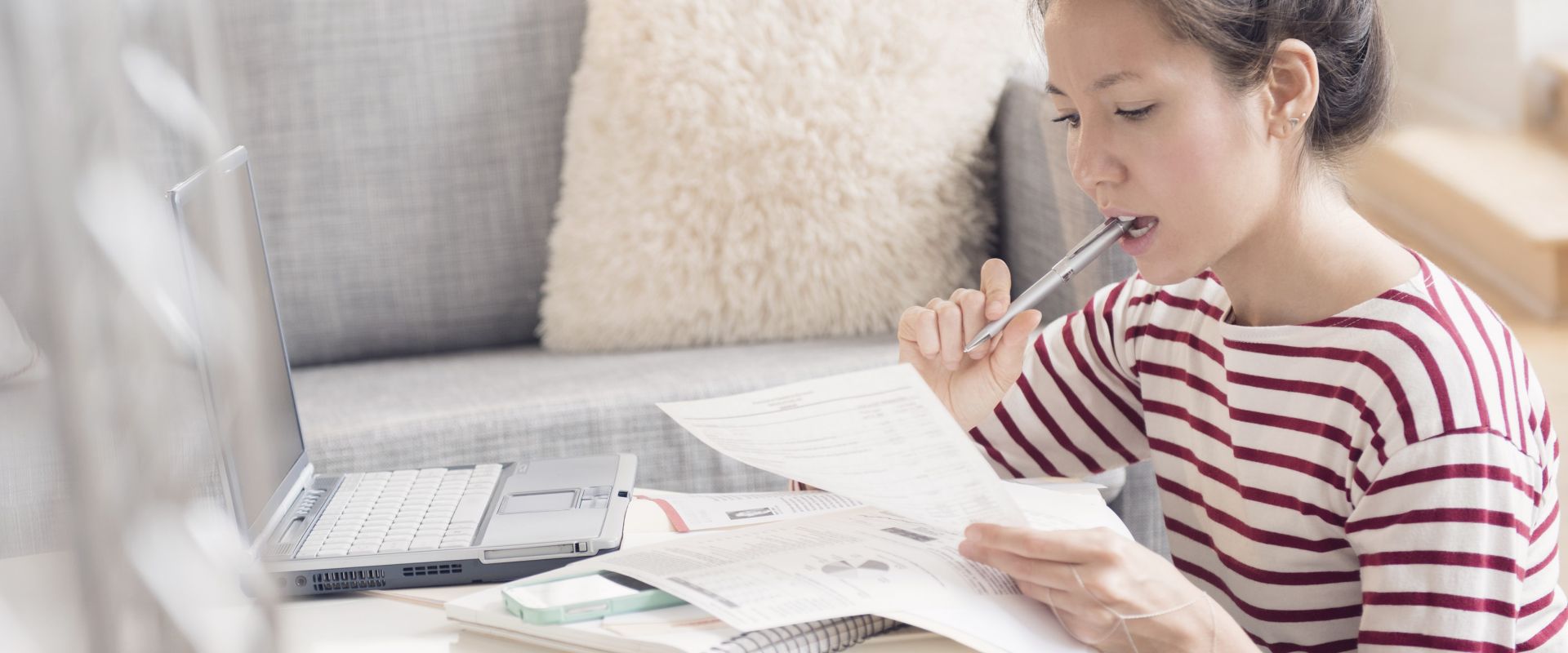 Woman paying bills on laptop