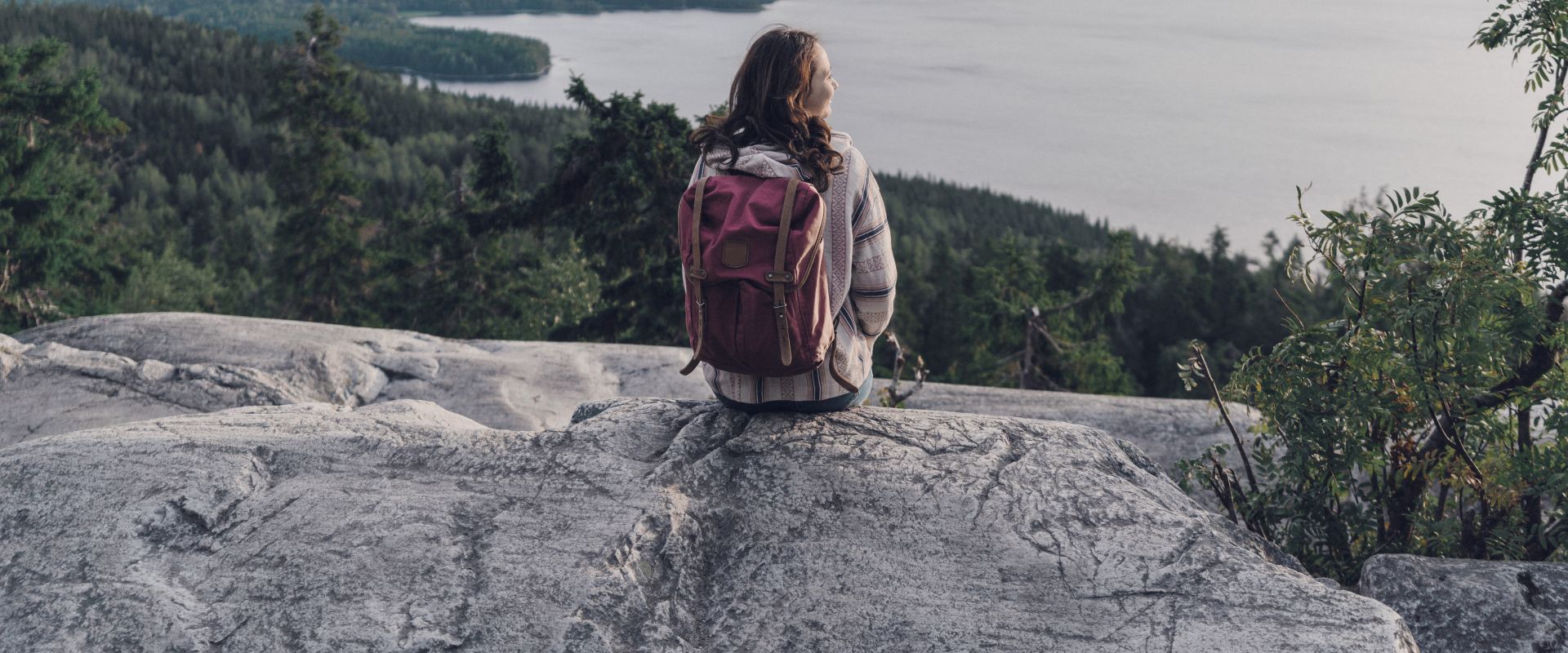 Woman looking at lake in Finland