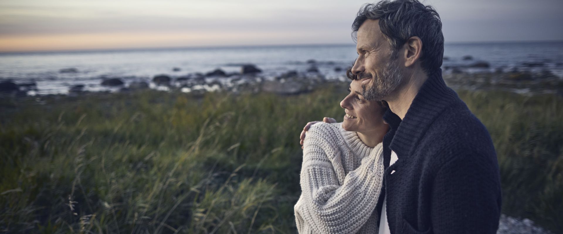 confident-couple-looking-at-view-at-the-sea.jpg