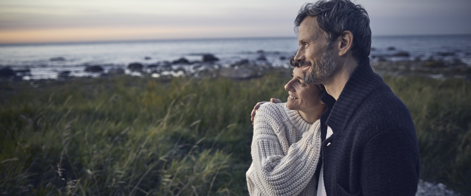 confident-couple-looking-at-view-at-the-sea.jpg