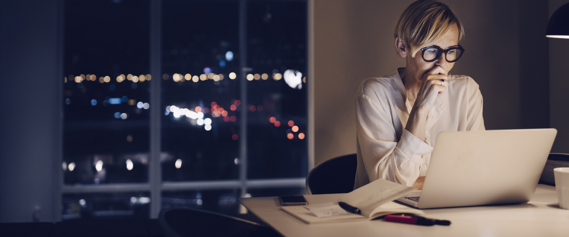 woman reading from a laptop