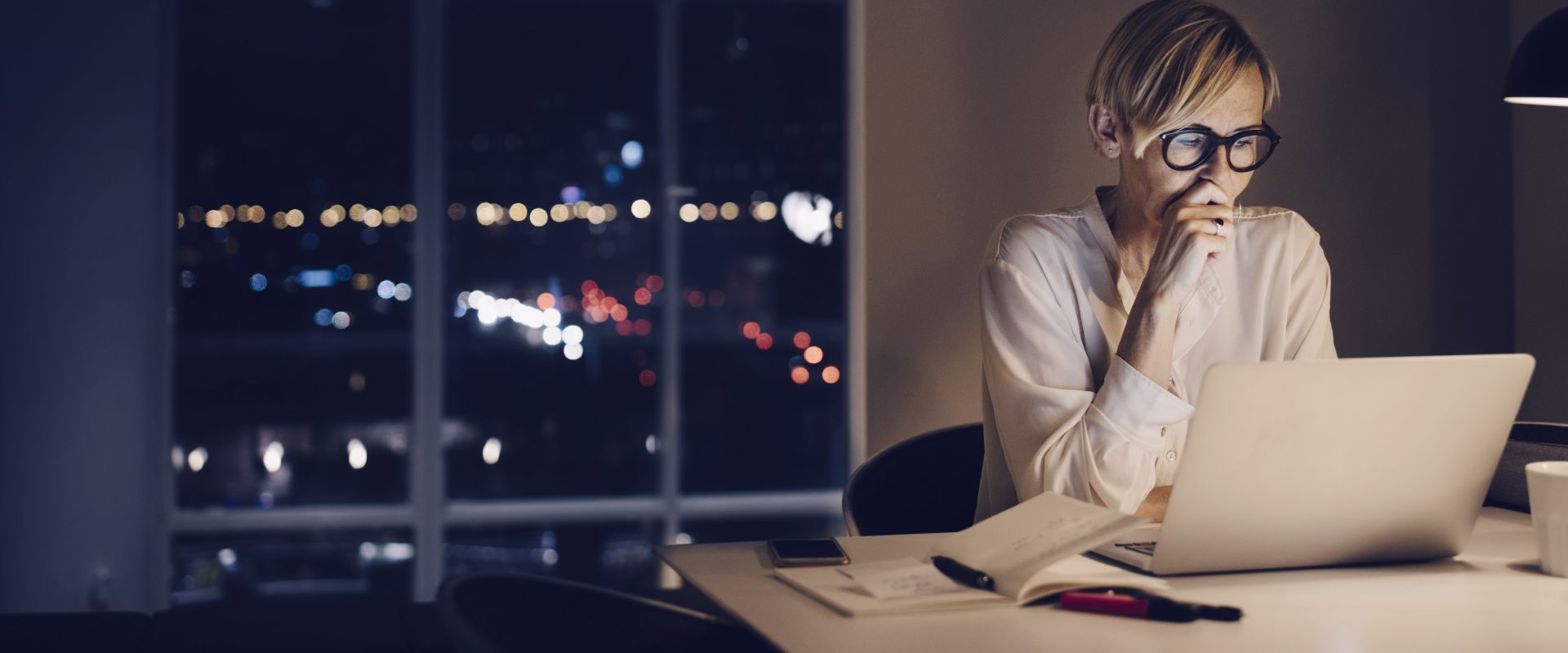 woman reading from a laptop