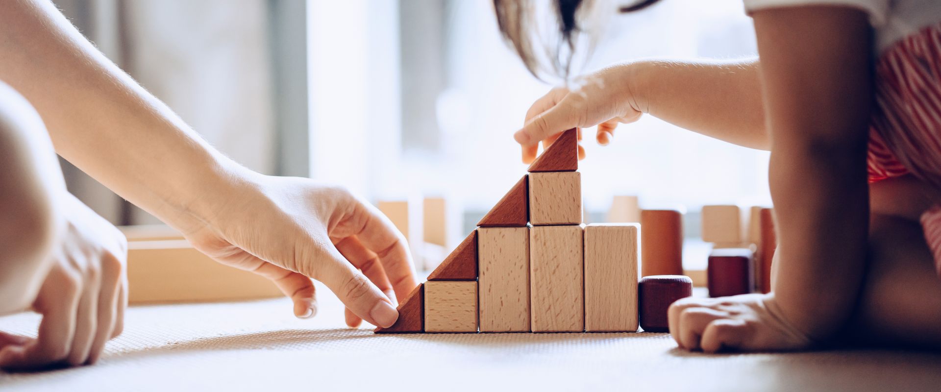 mother-and-daughter-playing-with-wooden-blocks